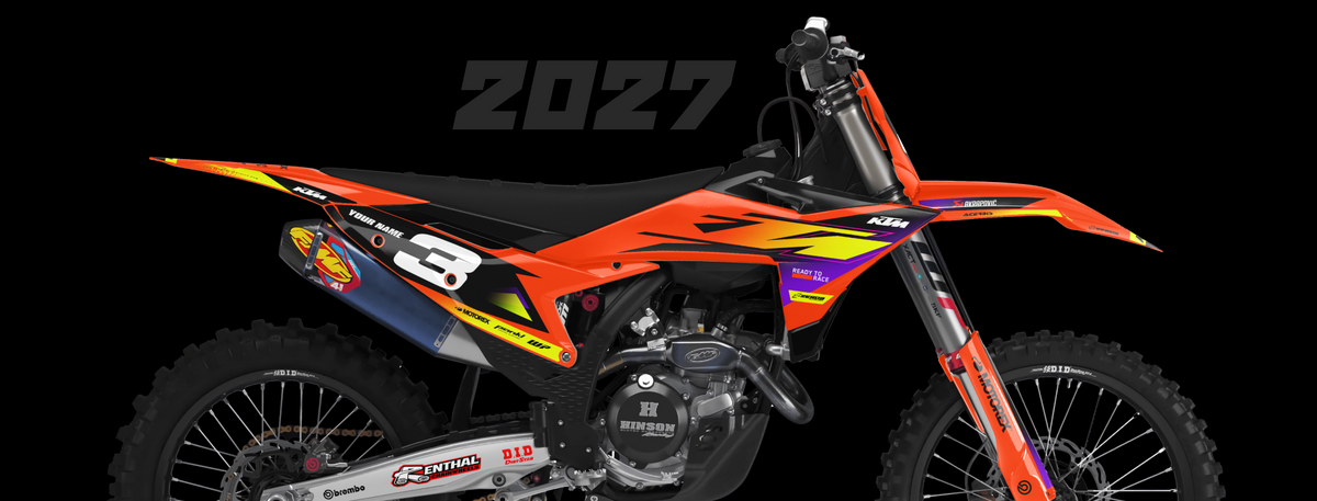 An orange and black motocross dirt bike with vibrant orange, yellow, and purple graphics, shown from a side profile against a solid black background with a '2027' text overlay.